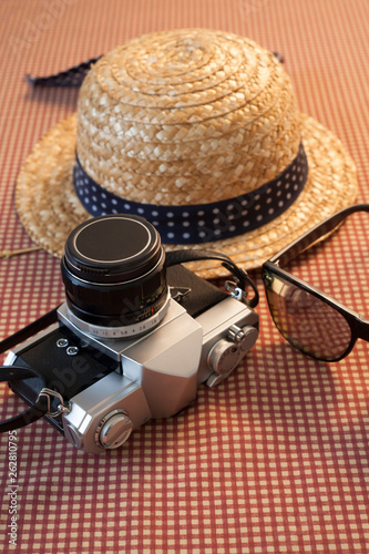 Camera sunglasses and a hat for travel
