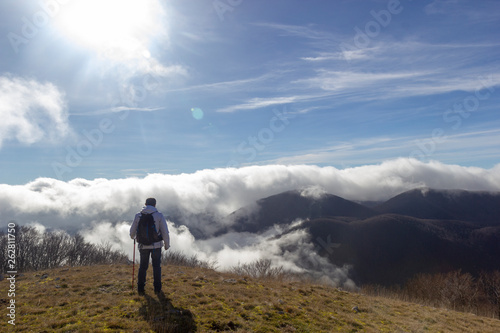 hiker above the clouds in campo dell'acero matese park