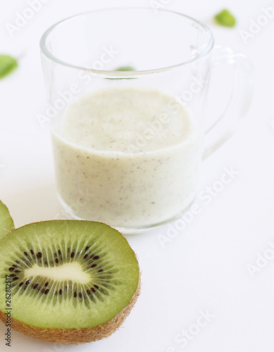 Healthy fresh kiwi smoothie with fresh fruits isolated on white background. Superfood, detox and healthy food.