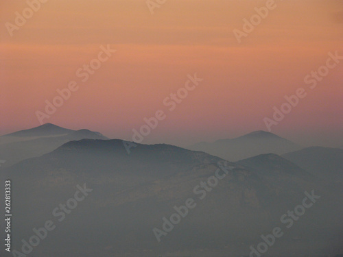 mountain summit in the clouds at sunset © Orabona Creative