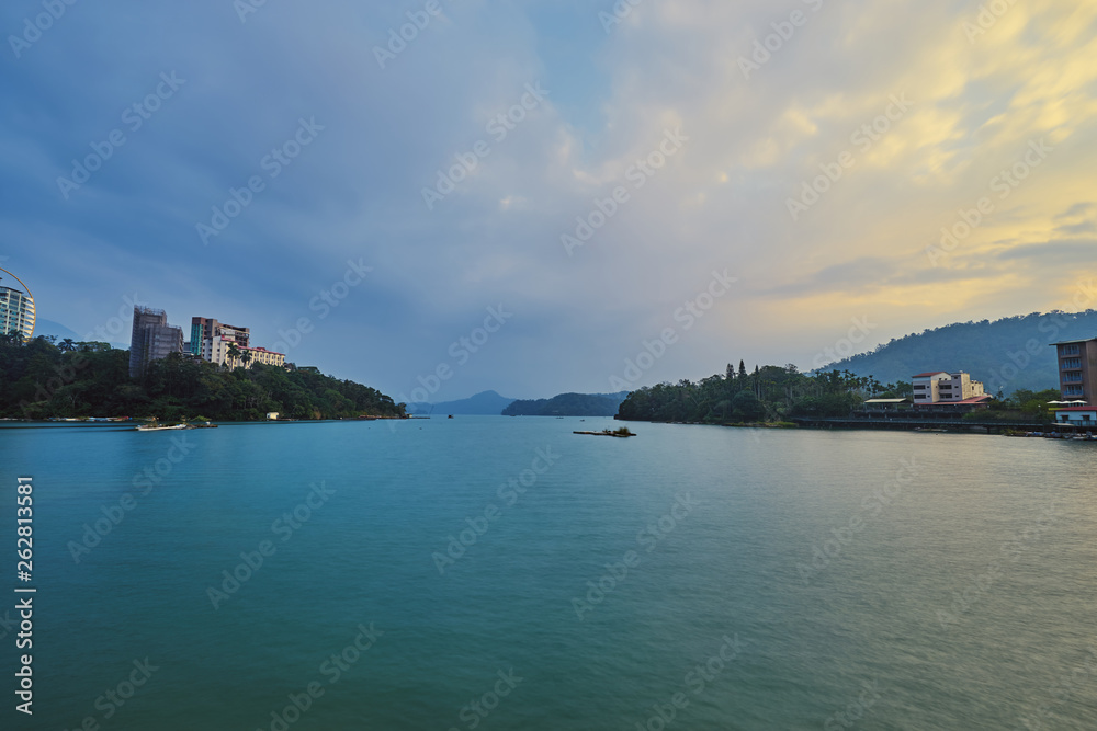 Beautiful sunset scenics of Sun Moon Lake with the surrounding mountains are the highlight at this sprawling lake at Yuchi, Nantou in Taiwan.
