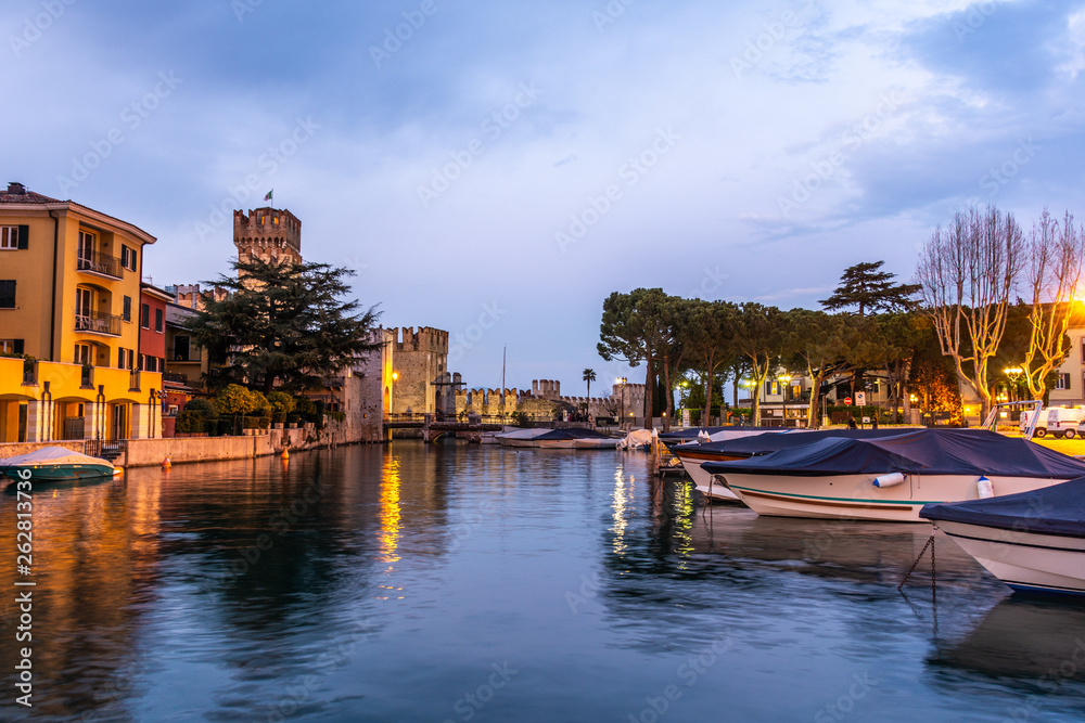 Rocca Scaligera Castle at sunset in Sirmione, Garda Lake, Italy