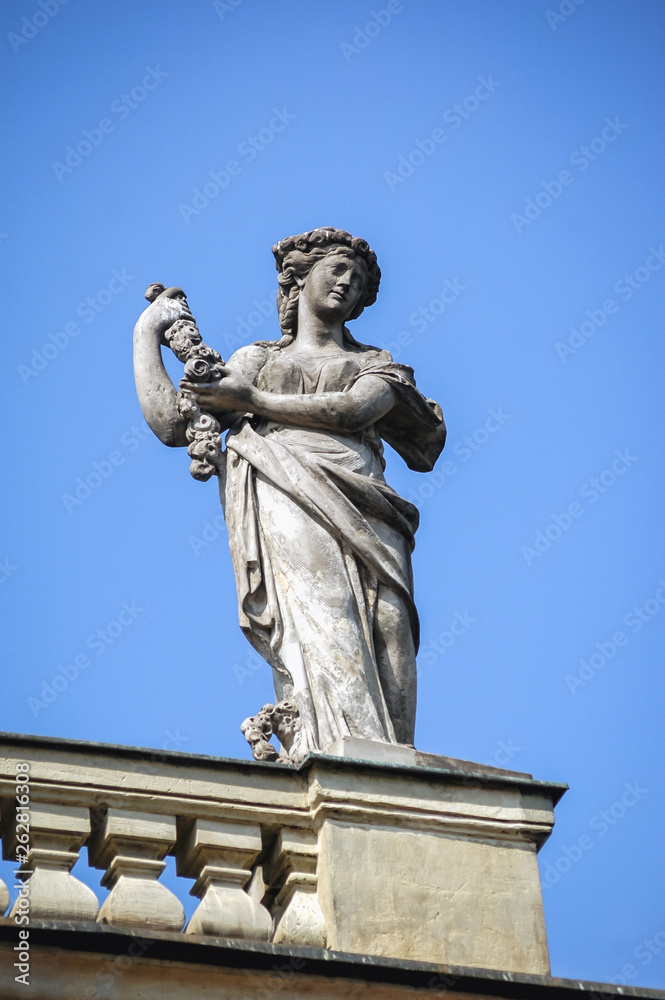 Statue on the roof of Palace on the Water also called Lazienki Palace in Royal Lazienki park in Warsaw, capital city of Poland