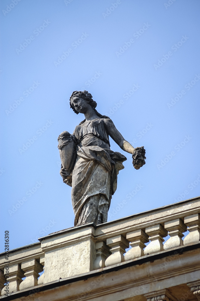 Statue on the roof of Palace on the Water also called Lazienki Palace in Royal Lazienki park in Warsaw, capital city of Poland