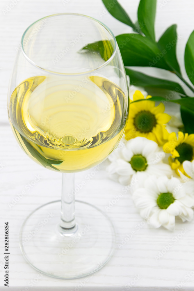 Glass of White Whine and Flowers