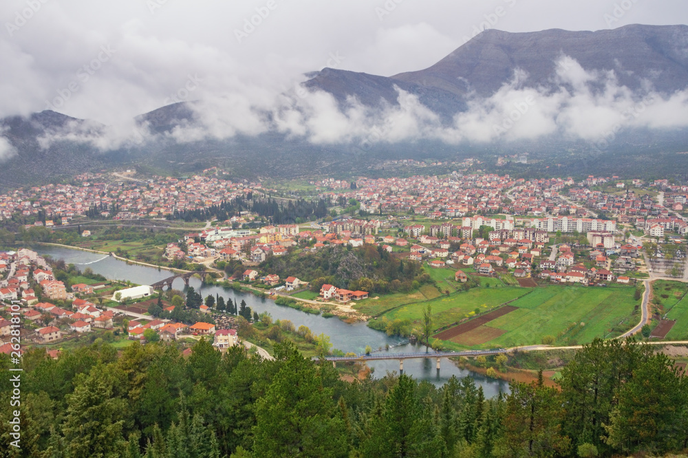 View of Trebinje city and Trebisnjica river from Crkvina Hill on rainy spring day. Bosnia and Herzegovina, Republika Srpska