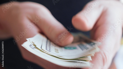 Businessman hands counting many american 20 dollars banknotes 4K close up slow mo