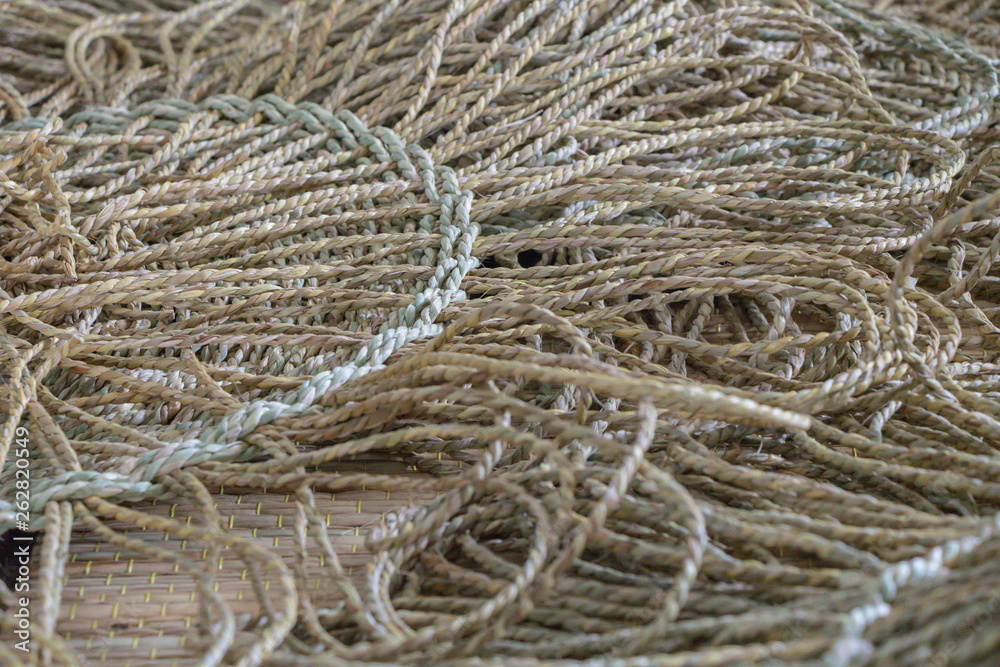 Wickerwork mat texture made from dry sedge background.Closeup surface texture of hand made craft work papyrus sedge. Wickerwork mat texture made from dry sedge background.Closeup surface texture of hand made craft work papyrus sedge.