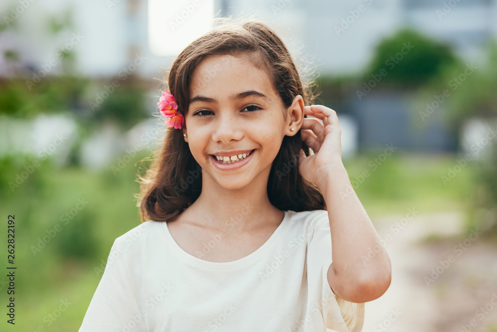 Cute little girl with a flower in her hair