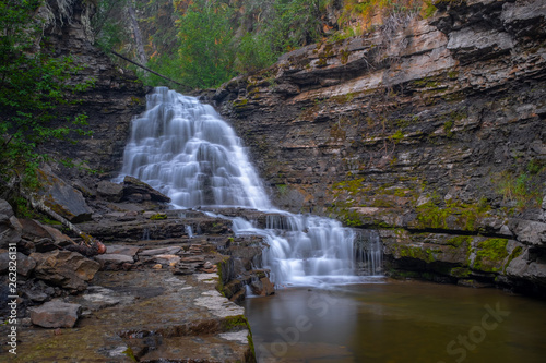 A distance shot of Quality Waterfall near Tumbler Ridge, British Columbia, Canada, long exposure to smooth out the water photo