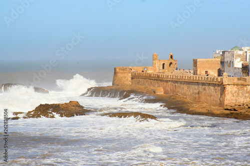 Essaouira Ramparts aerial panoramic view in Essaouira, Morocco with big waves. Essaouira is a city in the western Moroccan region on the Atlantic coast.