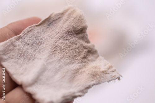 Dirty  used cotton pads and stains from  remover make up cosmetics on isolate background.