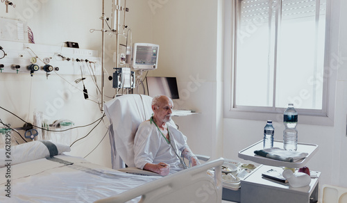 Older man admitted to a hospital room due to health problems