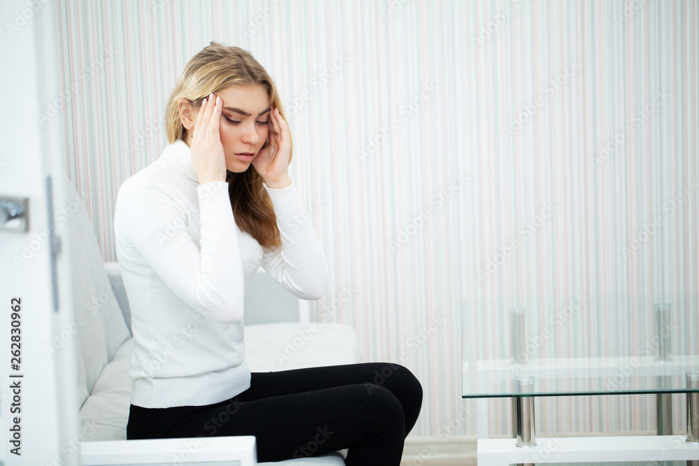 Head pain. Young woman keeping hand on her head Head pain. Young woman keeping hand on her head