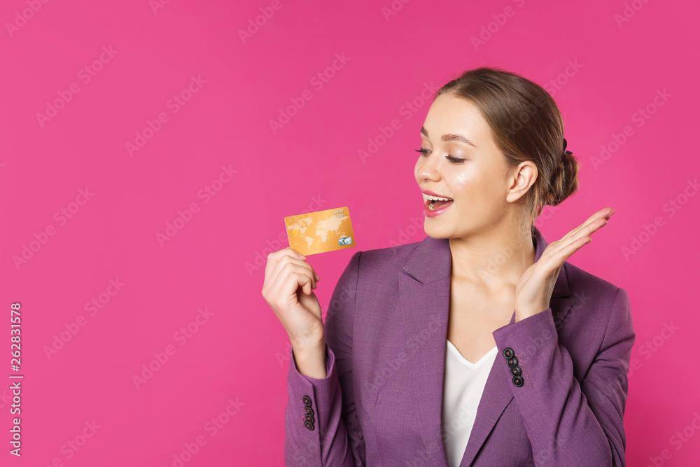 Happy businesswoman with credit card and space for text on color background. Money transaction Happy businesswoman with credit card and space for text on color background. Money transaction