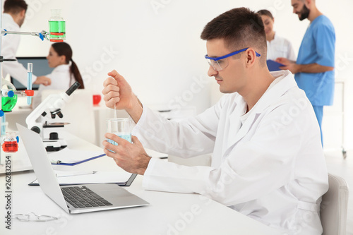 Wallpaper Mural Medical student working in modern scientific laboratory Torontodigital.ca