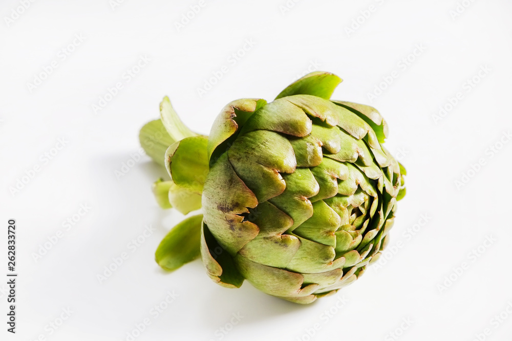 Obraz premium Fresh green Italian Artichoke isolated on white background. Organic local produce vegetable. Vegan diet. Clean eating concept. Close up, top view.