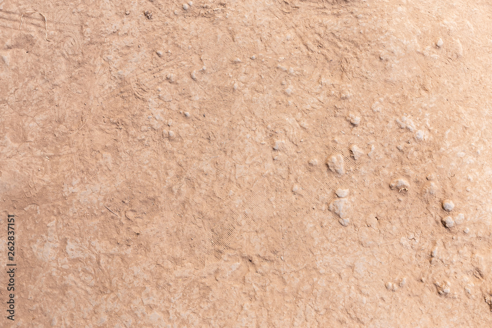 Brown dry soil or cracked ground texture background. Brown dry soil or cracked ground texture background.