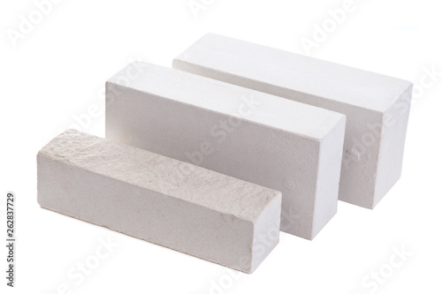 Three white ceramic bricks at the white background, isolated