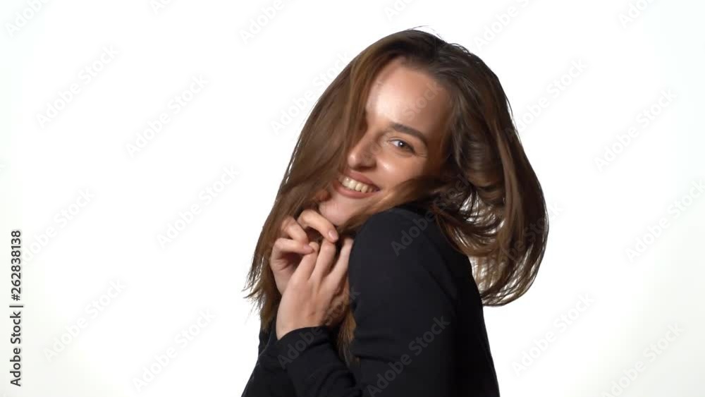 Woman looking at camera with joyful and charming smile Woman looking at camera with joyful and charming smile