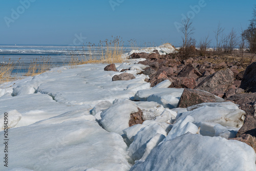 seascape sea covered with broken ice on a Sunny spring day.beautiful natural background