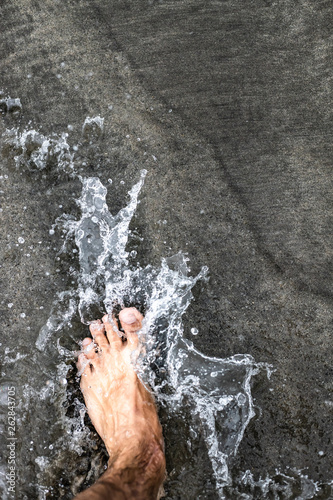 Foot in the water at the beach