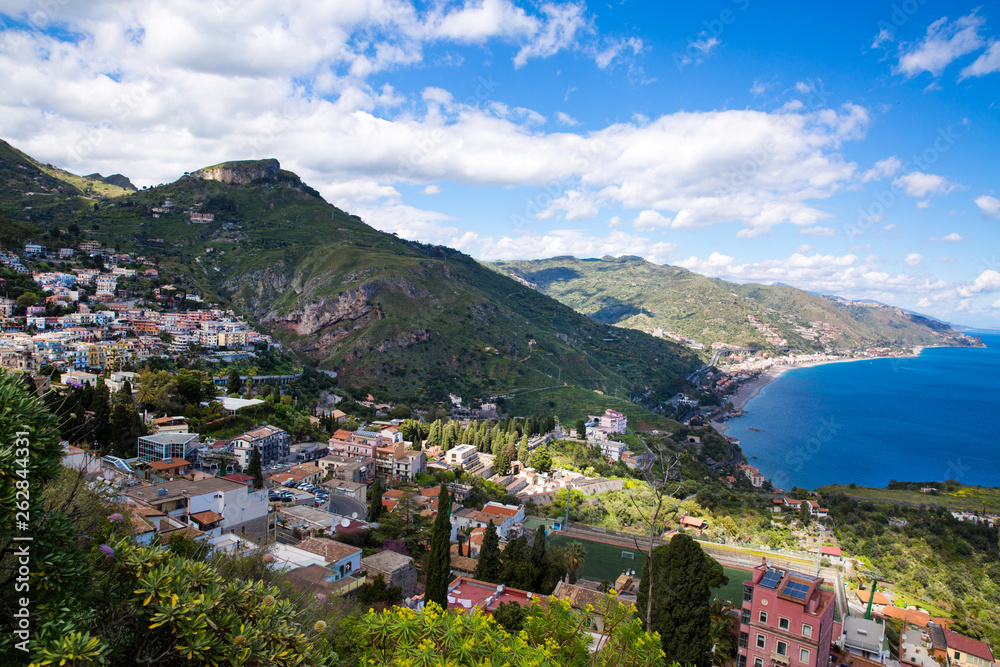 Beautiful landscape panorama of Sicily coastline. Blue Mediterranean sea and green mountians, Taormina, Sicily island, Italy. 