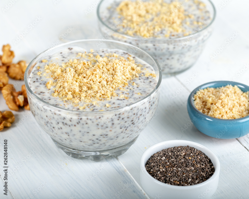 Chia pudding made with milk, banana and decorated with walnut Chia pudding made with milk, banana and decorated with walnut