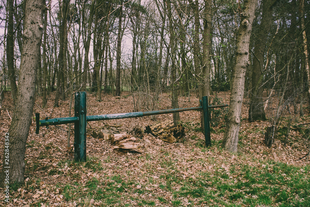 Iron bar prohibiting trespassing in a forest Iron bar prohibiting trespassing in a forest