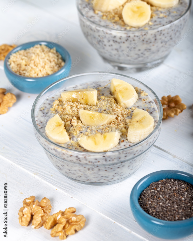 Chia pudding made with milk, banana and decorated with walnut Chia pudding made with milk, banana and decorated with walnut