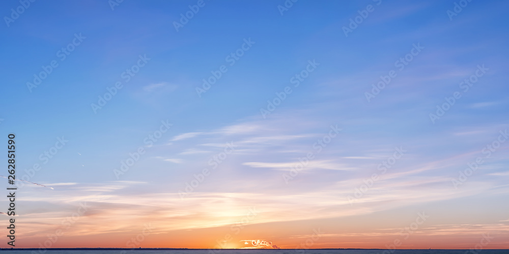 Winter horizon at sunset with bright colored clouds