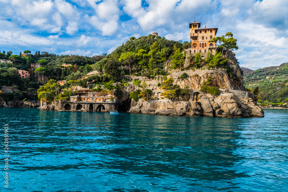 View from the boat over the scenic road to Portofino and house on the hill, Liguria region in Italy