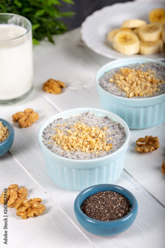 Chia pudding made with milk, banana and decorated with walnut Chia pudding made with milk, banana and decorated with walnut