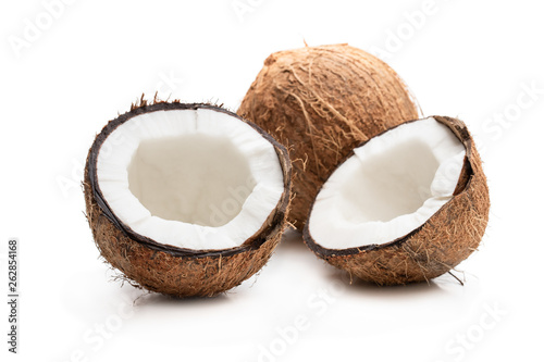 craked and whole coconuts isolated on white background