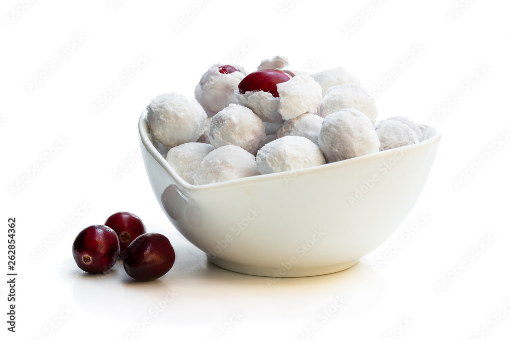 Frosted sugar coated cranberry in white saucer Frosted sugar coated cranberry in white saucer