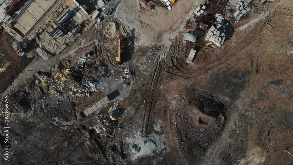 Drone flying over a construction site with a top down view. The camera flies superstructure, top-down view. Aerial view 4K
