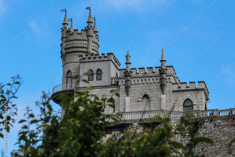 Swallow Nest aerial drone shot, ancient castle on top of mountain cliff near sea Yalta region, Crimea. Beautiful famous palace architecture and amazing nature landscape Swallow Nest aerial drone shot, ancient castle on top of mountain cliff near sea Yalta region, Crimea. Beautiful famous palace architecture and amazing nature landscape
