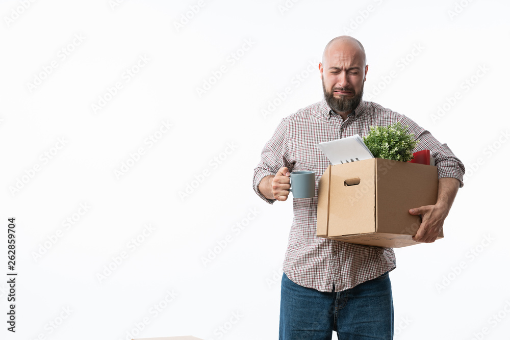 Fired businessman holding box with personal belongings. Fired businessman holding box with personal belongings.