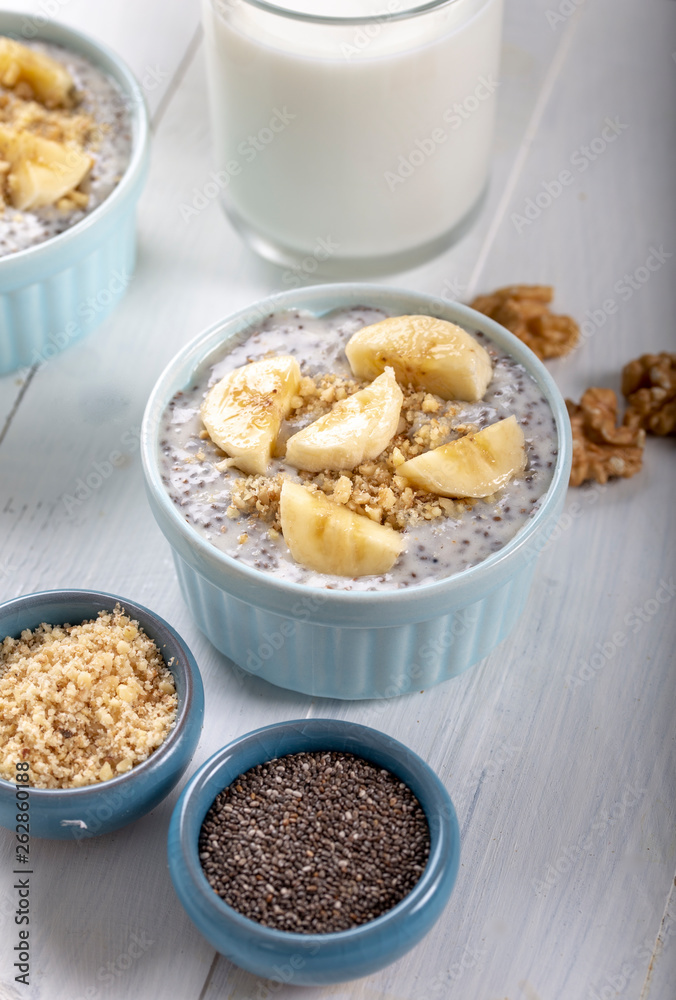 Chia pudding made with milk, banana and decorated with walnut Chia pudding made with milk, banana and decorated with walnut