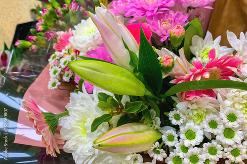 Bouquet of flowers from gerberas, lilies and chrysanthemums (closeup)