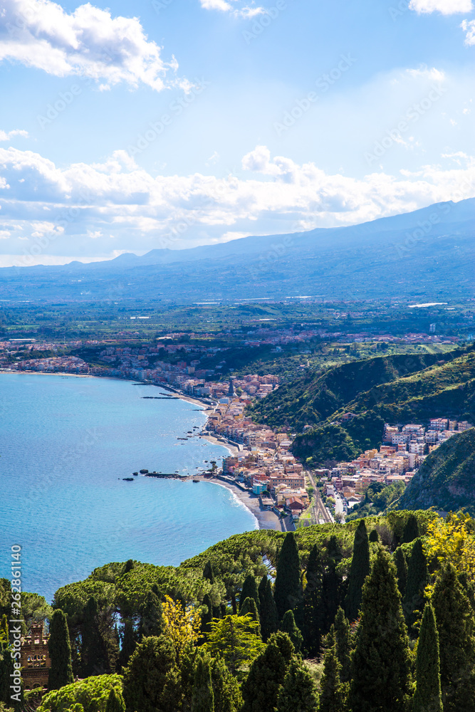 Beautiful view to Etna volcano and Mediterranean sea, Taormina, Sicily island, Italy. 