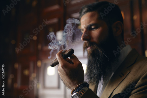 Man smoking cigar photo