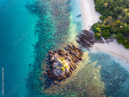 Aerial view of a sandy beach and a boat aground in Kapas Island, Malaysia photo