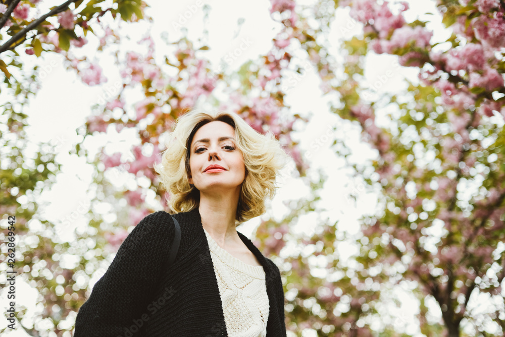 Portrait of attractive woman in spring blossom Portrait of attractive woman in spring blossom