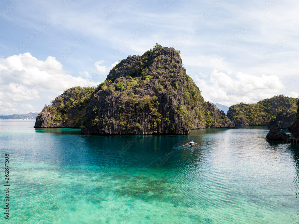 Aerial view of green islands in emerald waters in Coron, The Philippines Aerial view of green islands in emerald waters in Coron, The Philippines