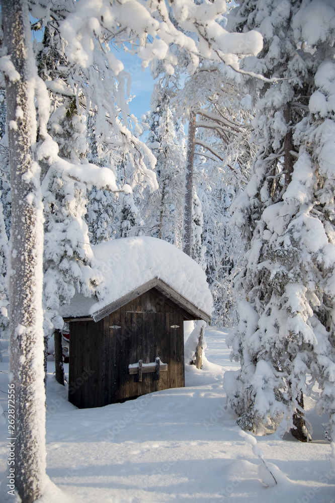 Snow covered cabin in Lapland Snow covered cabin in Lapland