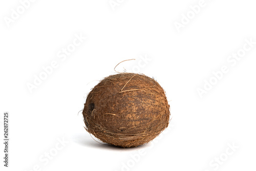 Coconut on white isolated background. Coconuts lie on the counter, the concept of drinking milk and coconut water. Using exotic fruits.