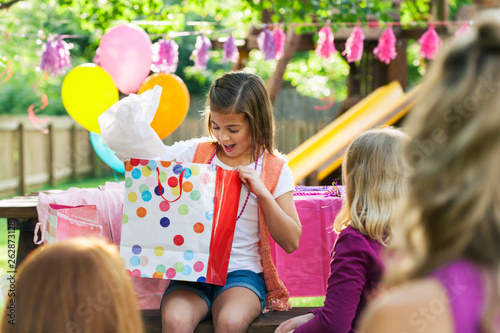 Birthday: Girl Looking Into Gift Bag For Present