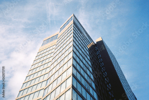 Glass building on blue sky background