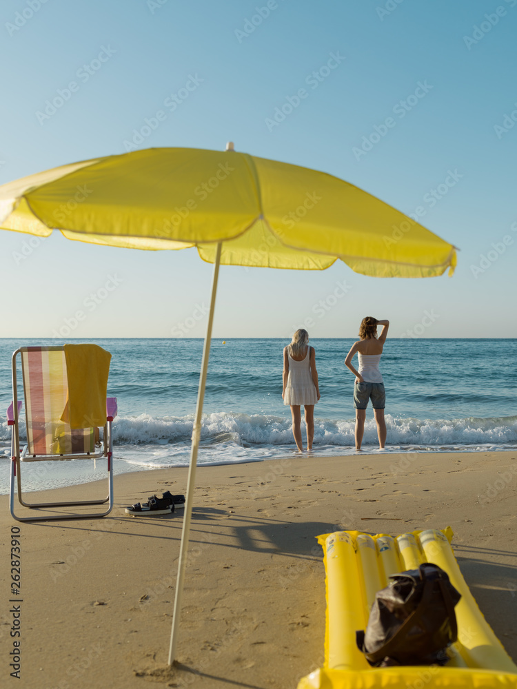 Girls relaxing on beautiful beach